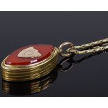 A Victorian gilt-metal and carnelian pendant photo locket, on a gilt-metal chain, locket height 29.