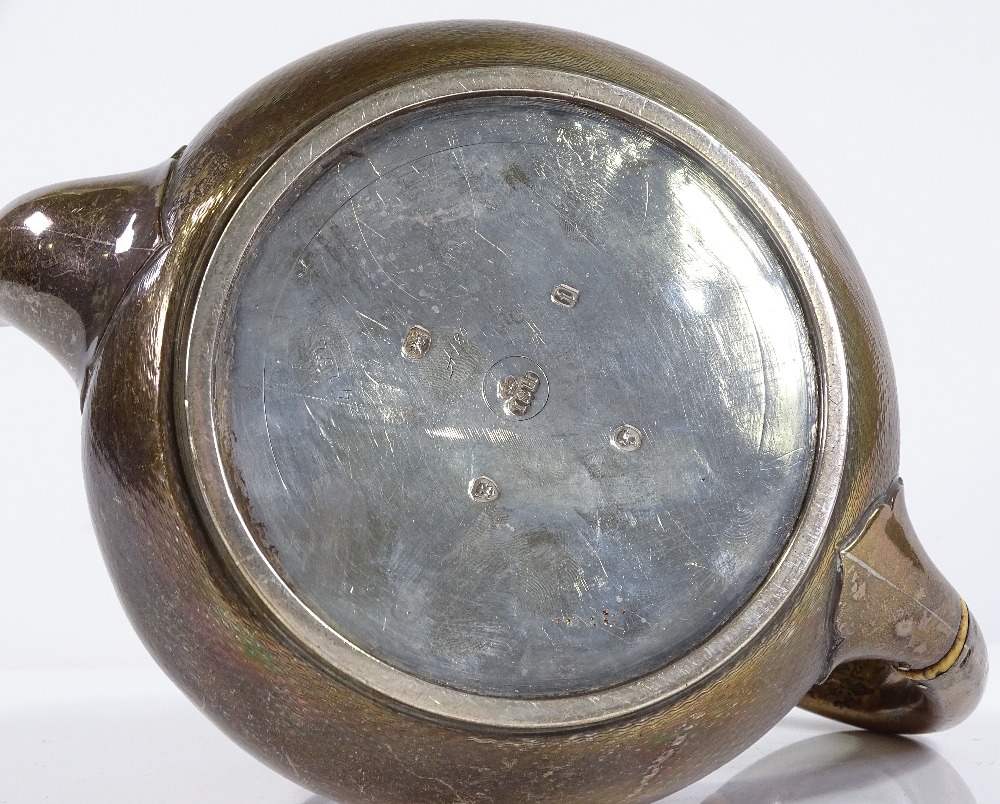 A Victorian tapered circular silver teapot, with engine turned body and ivory insulators, by John - Image 3 of 3