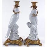 A pair of white glaze porcelain parakeet candle holders, with ornate gilt-metal mounts, height 36cm