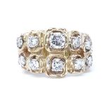 A 14ct gold abstract diamond set ring, largest diamond approx 0.32ct, maker's marks CKG, setting