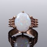 A 9ct gold cabochon opal ring, setting height 13.8mm, size M, 3.5g