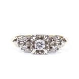 An 18ct gold solitaire diamond dress ring, with diamond set shoulders, central stone approx 0.