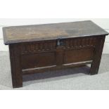 An 18th century oak coffer of plank construction, with carved and panelled front, length 3'8"