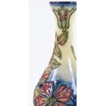 A Moorcroft Christmas Rose pattern narrow-necked vase by Rachel Bishop, height 17cm