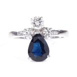 An 18ct white gold sapphire and diamond dress ring, with baguette-cut diamond shoulders, pear-cut