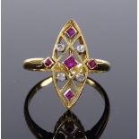 An 18ct gold ruby and diamond marquise-shaped ring, with pierce openwork panel, panel height 19.2mm,