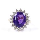 An 18ct gold amethyst and diamond cluster ring, setting height 17.2mm, size O, 6.5g