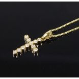 An 18ct gold diamond set cross pendant, on 18ct gold chain, pendant height 20.1mm, chain length