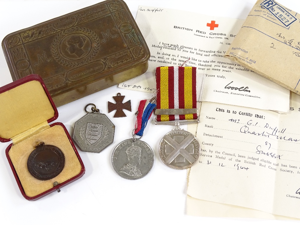 A group of commemorative medals, a Life Saving medal, Queen Mary 1914 Christmas tin etc