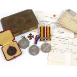 A group of commemorative medals, a Life Saving medal, Queen Mary 1914 Christmas tin etc