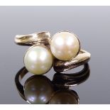 A 9ct gold double pearl crossover ring, setting height 11.6mm, size M, hallmarks Birmingham 1987, 4g