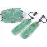 A carved jade brooch, length 32.5mm, together with a pair of carved jade earrings (2)