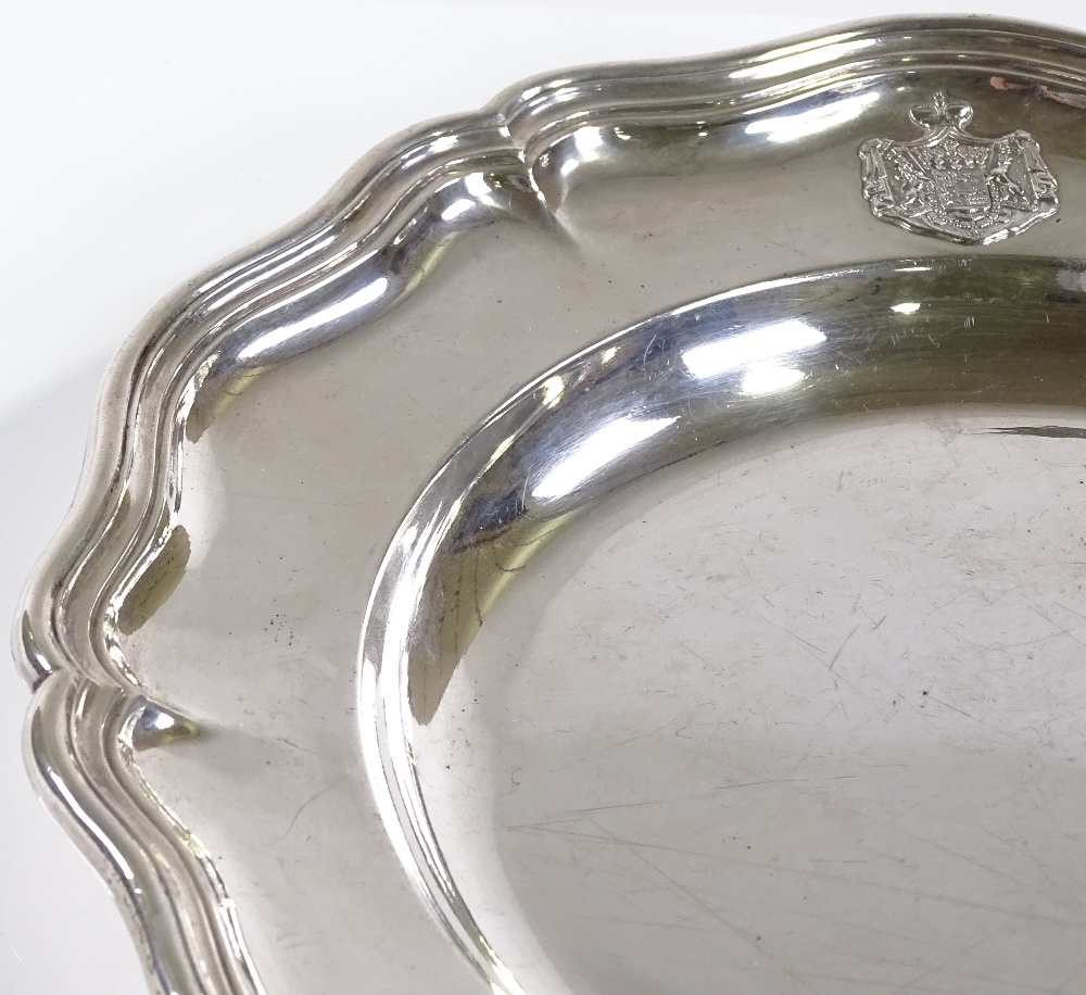 An Austrian Imperial circular silver card tray / salver, with scalloped border and cast-silver