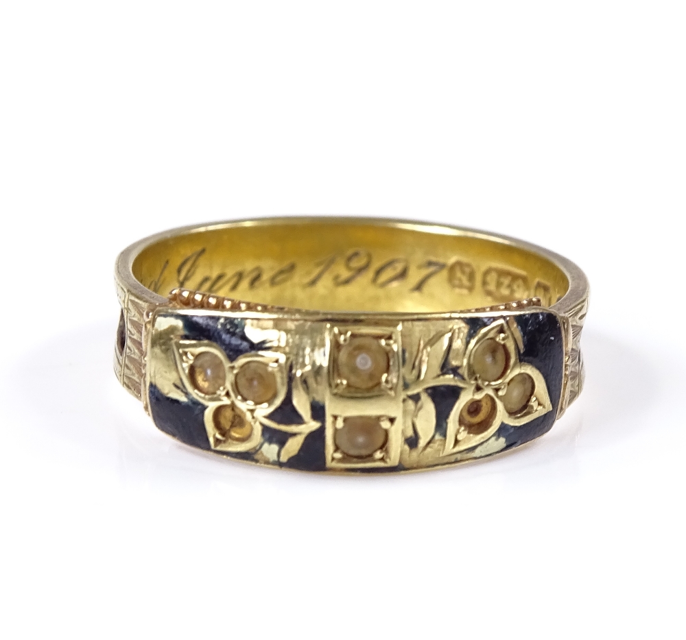 A 15ct gold pearl and black enamel band mourning ring, with pierced hair panel shank (no hair),