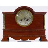An Edwardian mahogany-cased mantel clock, with brass columns, silvered dial, and 8-day striking