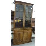 An early 19th century mahogany library bookcase, with lancet lattice-glazed doors, frieze drawers