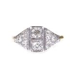 An 18ct gold diamond cluster panel ring, with platinum-topped settings and diamond set shoulders,