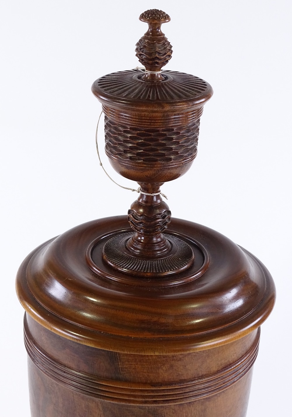 A large lignum vitae wassail bowl and cover, the circular lid surmounted with a spice cup and cover,