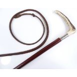 A Victorian horn-handled leather riding whip
