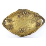 A Bouny, gilt patinated bronze 2-handled dish, with relief cast floral decoration, signed, length