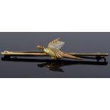 A platinum 15ct gold and enamel pheasant bar brooch, with 3 coloured gold textured body, brooch