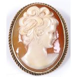 A relief carved cameo panel brooch, in 9ct gold frame with rope twist surround, depicting female