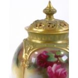 A Royal Worcester floral painted porcelain pot pourri jar and cover, height 11cm
