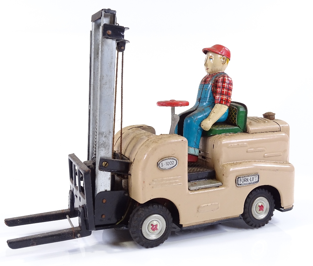 A Japanese tinplate battery operated toy forklift truck, length 27cm