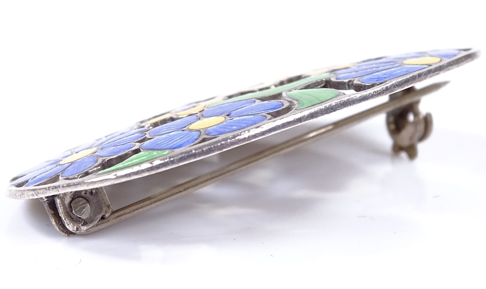 An Arts and Crafts silver and coloured enamel oval brooch, with floral decoration, maker's marks D - Image 4 of 4