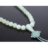 A single string of polished jade beads, length 520mm