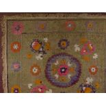 An early 20th century silk embroidered floral decorated panel, modern frame, panel dimensions 70cm x