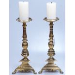 A pair of 18th century brass pricket candle stands, with inscriptions to the bases, height 12.5"