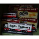 A group of diecast model buses etc