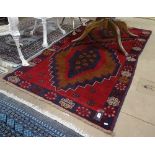 A red ground Beluchi rug, 190cm x 103cm