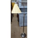 A mid-century copper telescopic arch lamp and shade