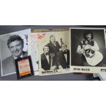 A collection of autographed photos and ephemera
