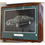 A set of 8 framed prints, depicting various Aston Martins, width 25.5" overall