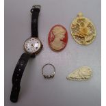 A lady's 9ct gold cased wristwatch, brooches etc