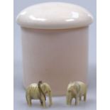 A screw-top ivory pot, height 3", and 2 miniature elephants