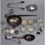 A box containing a silver-handled button hook, silver coins, a decanter label etc