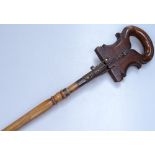 An unusual Victorian brass-mounted beech shooting stick