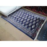 A blue ground Afghan design rug, 190cm x 130cm