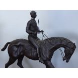 A reproduction bronze racehorse and jockey, height 15"