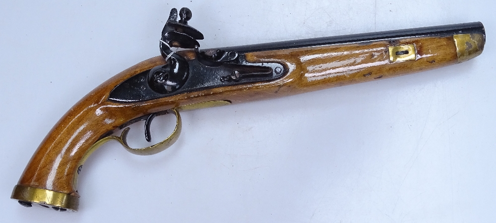 A mid-20th century replica flintlock pistol