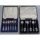 2 cased sets of silver teaspoons