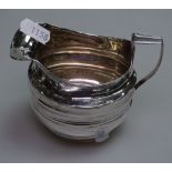 A George III silver milk jug with engraved decoration, H10cm, 4.1oz