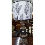 A large patinated table lamp and shade, H100cm