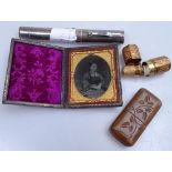 Box containing Victorian leather-cased daguerreotype photograph, a hallmarked silver torch, and 2