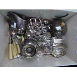 A box containing plated cutlery, muffin dish, cream jug etc