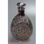 An ornate sterling 950 silver overlay decanter and stopper, with allover floral decoration, H22.5cm